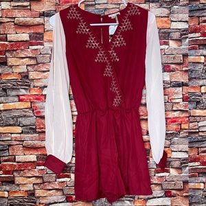 Red romper with open sleeves and open back